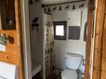 Cozy bathroom complete with sink toilet and shower